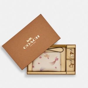 NWT Coach Wristlet with Charms in Box